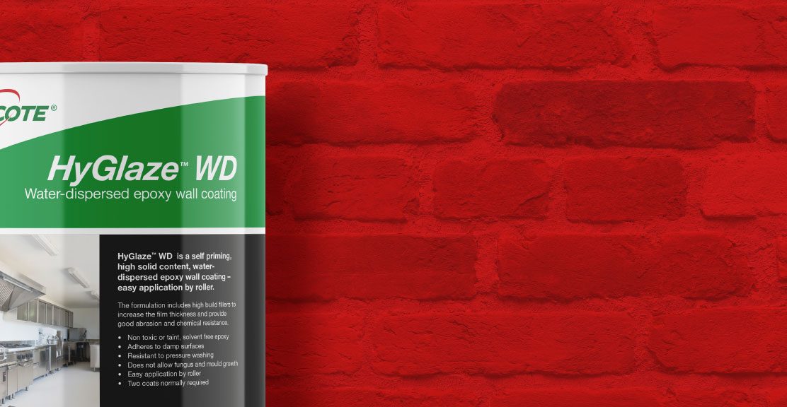 bucket of epoxy wall coating against a red brick wall