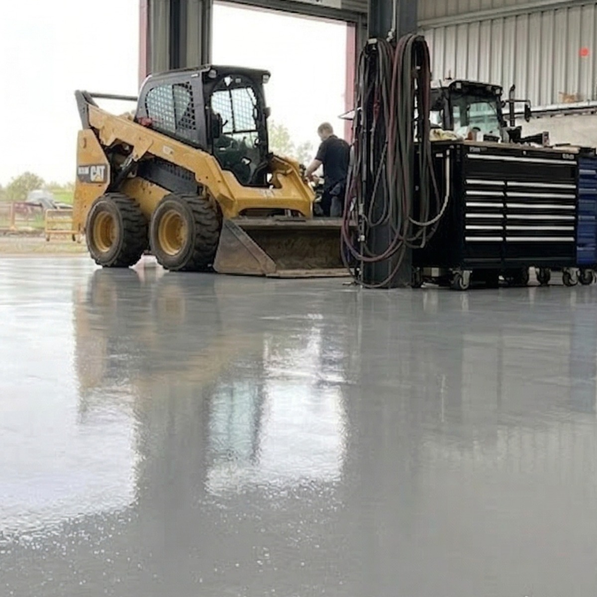 Epoxy floor on a busy farm garage workshop